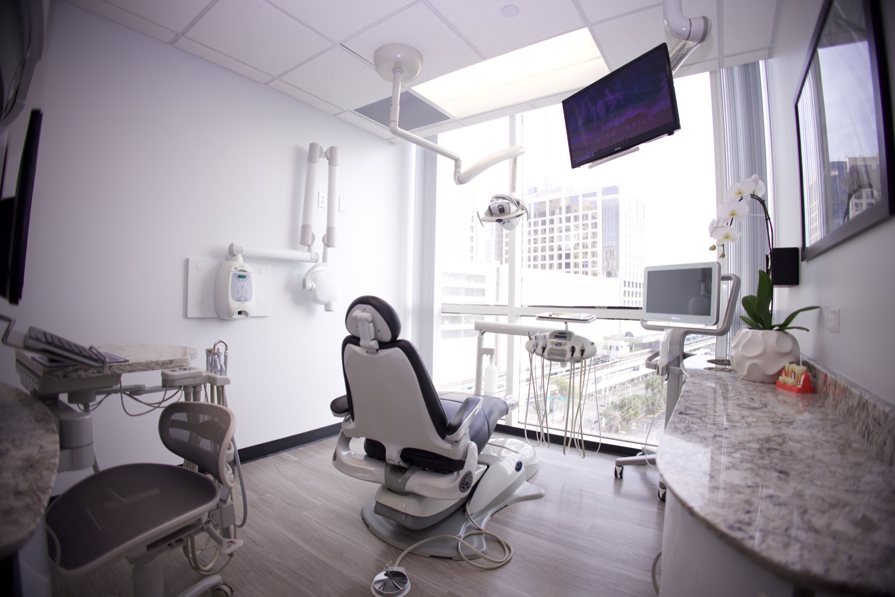 A treatment room with a skyline view at Miami Smile Dental in Pinecrest